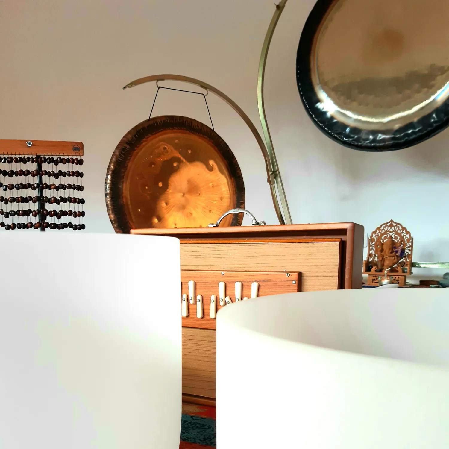 Sound healing instruments including gongs, harmonium, and singing bowls at Casa Alma
